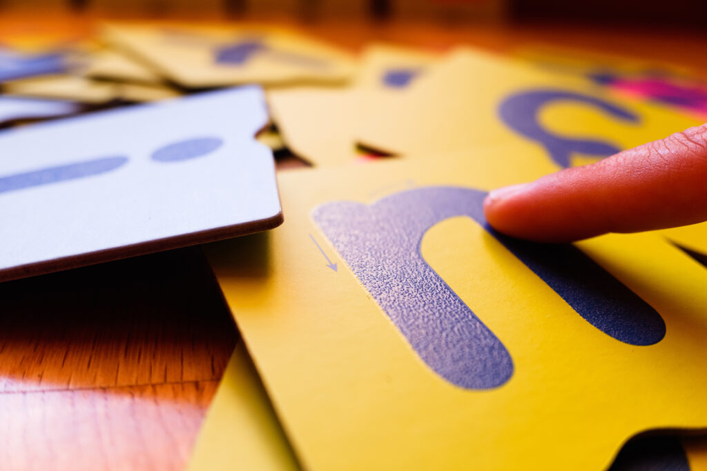 Montessori letter cards, finger swipe texture, enhances dyslexic